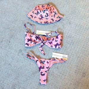 White Fox bikini with matching bucket hat. Pink with butterfly design.